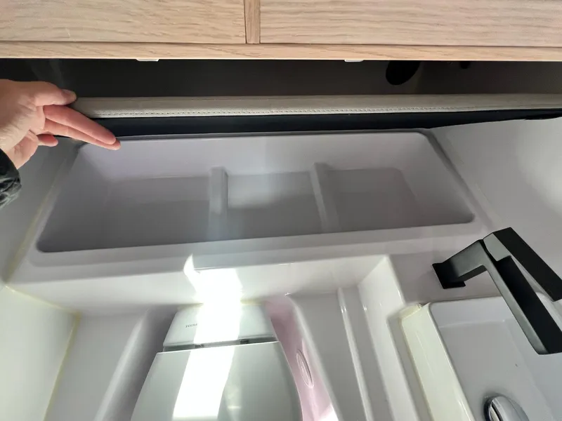 Slide: The Image of Interior view of 2024 Axopar 45 XC Cross Cabin kitchen sink area. - 41