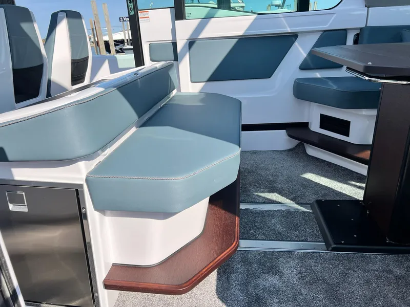 Slide: The Image of 2024 Axopar 45 XC Cross Cabin interior with modern seating and sleek design. - 7