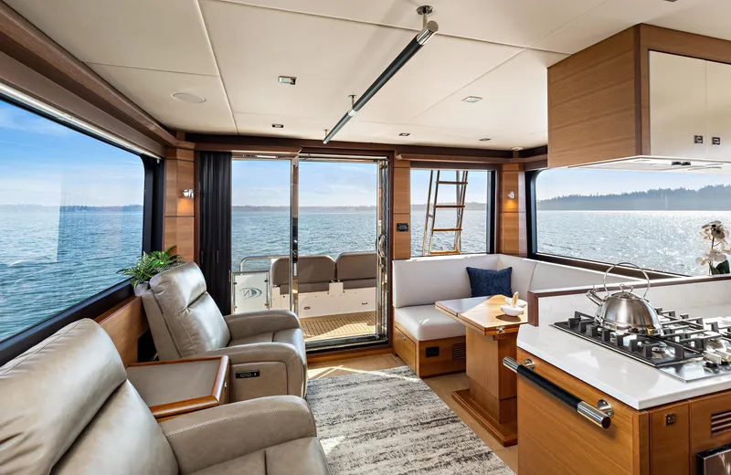 Slide: The Image of Luxurious interior of 2025 North Pacific 450 Pilothouse yacht with ocean view. - 1