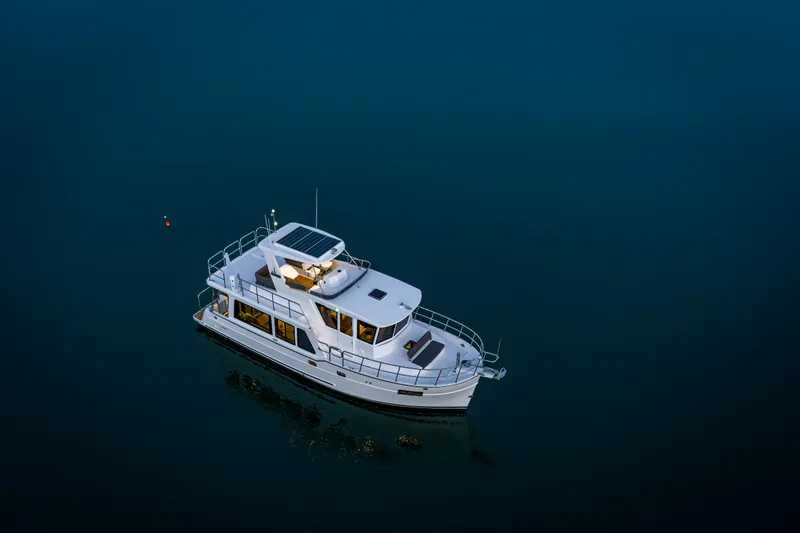 Slide: The Image of 2025 North Pacific 450 Pilothouse yacht on calm water, aerial view. - 43