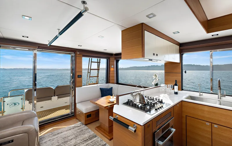 Slide: The Image of Luxurious interior of 2025 North Pacific 450 Pilothouse yacht with ocean view. - 5