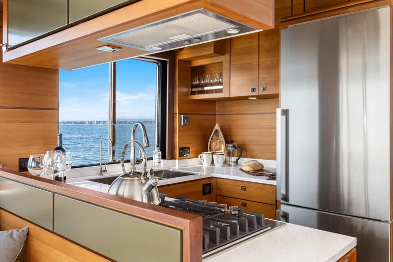 Slide: The Image of Modern kitchen in 2025 North Pacific 450 Pilothouse yacht with ocean view. - 9