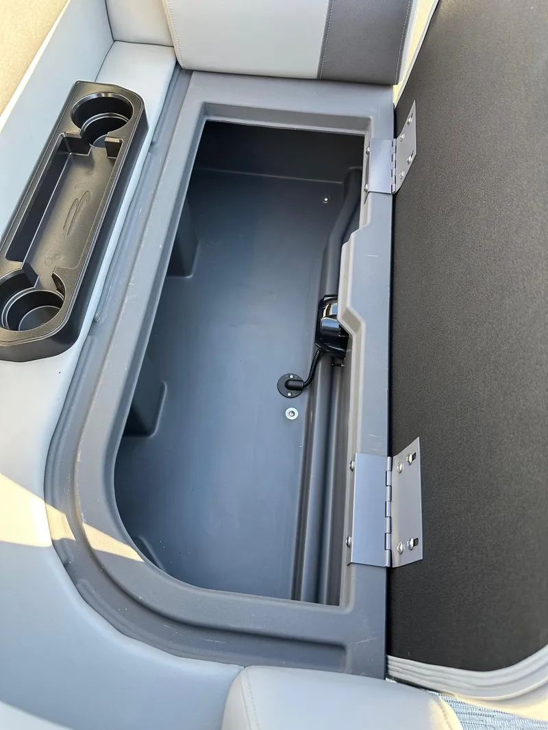Slide: The Image of Bennington 188 SLJ boat storage compartment with cup holders, 2026 model. - 10