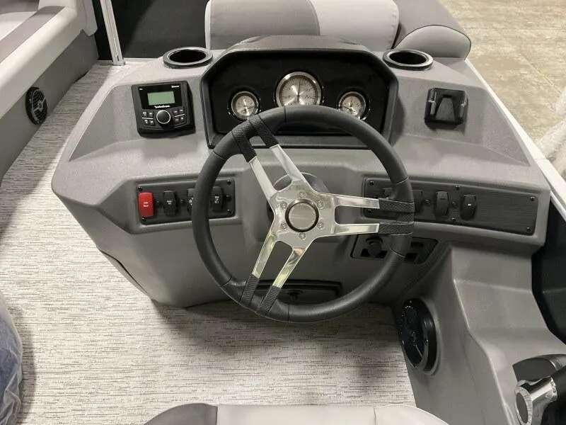 Slide: The Image of Steering console of 2026 Bennington 188 SLJ boat, featuring modern controls and gauges. - 20