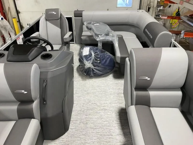 Slide: The Image of 2026 Bennington 188 SLJ pontoon boat interior with gray seating and steering console. - 24