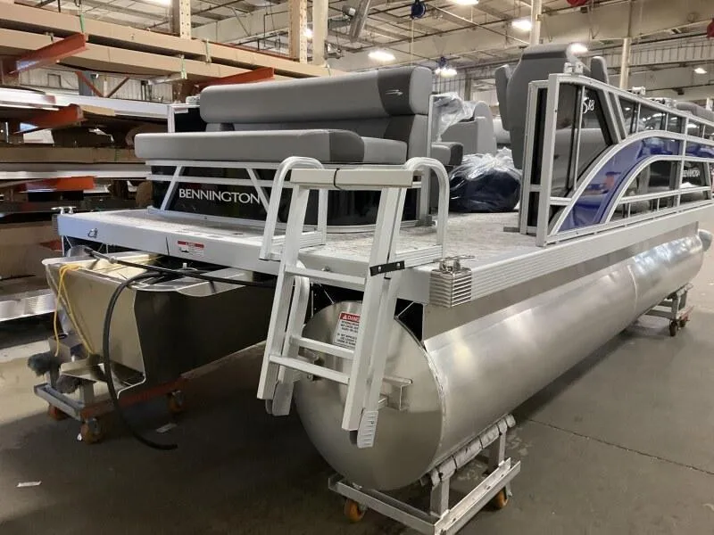 Slide: The Image of 2026 Bennington 188 SLJ pontoon boat in a warehouse, awaiting delivery. - 26