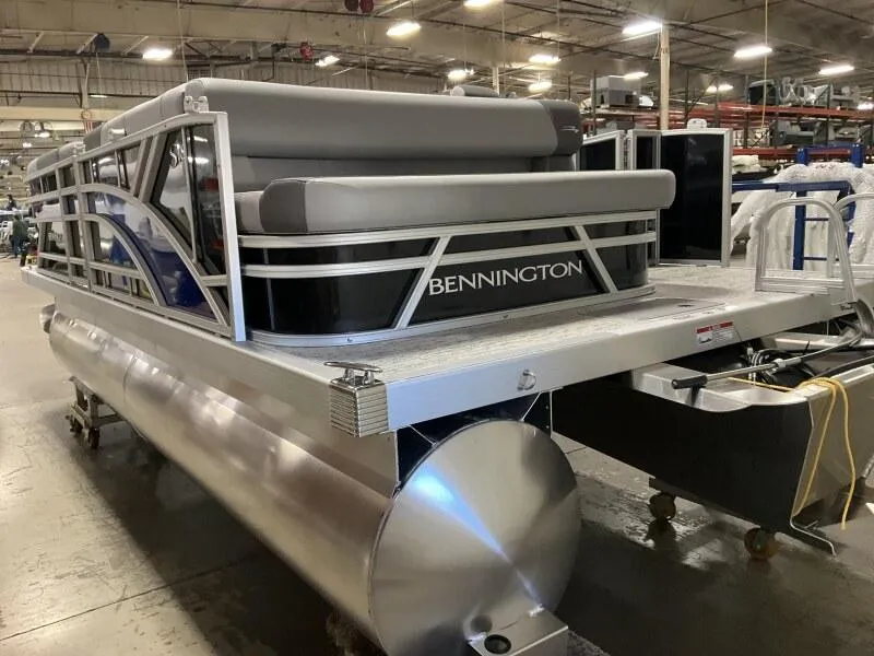 Slide: The Image of 2026 Bennington 188 SLJ pontoon boat in a factory setting, awaiting delivery. - 27