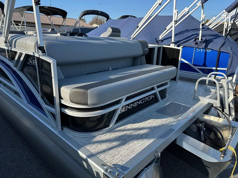 Slide: The Image of 2026 Bennington 188 SLJ pontoon boat with gray seating and sleek design. - 34