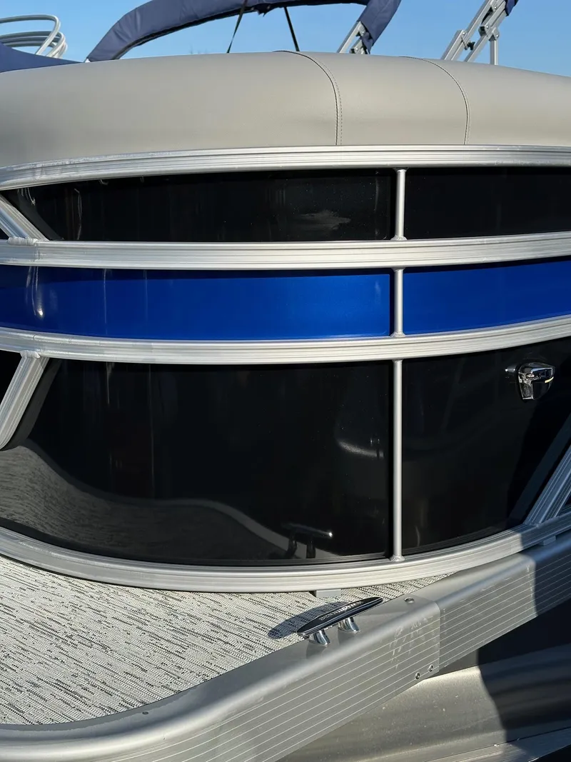 Slide: The Image of Close-up of 2026 Bennington 188 SLJ pontoon boat exterior with blue and silver accents. - 4