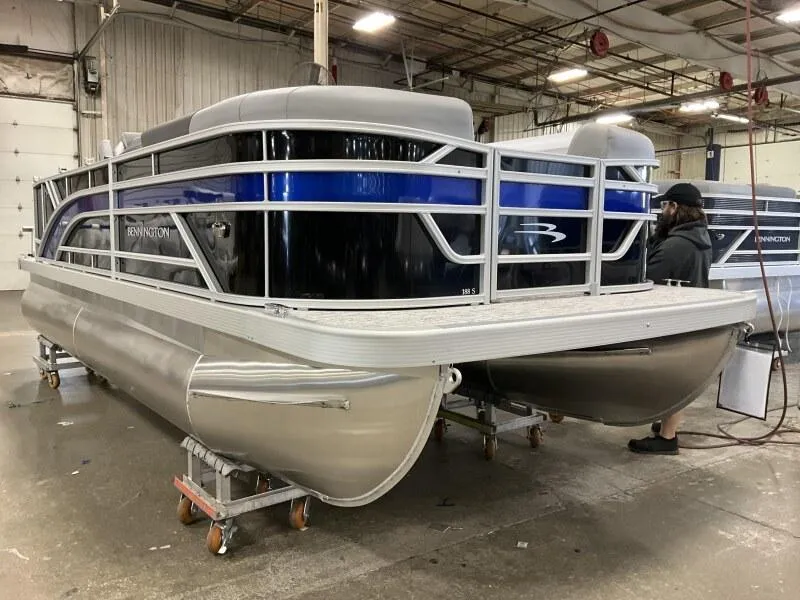 Slide: The Image of 2026 Bennington 188 SLJ pontoon boat in a warehouse, awaiting delivery. - 25