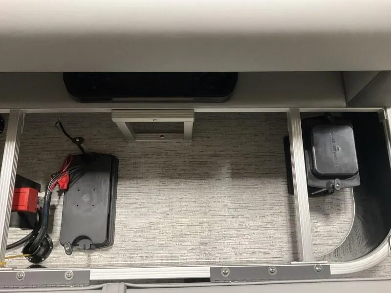 Slide: The Image of Storage compartment of 2026 Bennington 188 SLJ boat, featuring battery setup and wiring. - 30