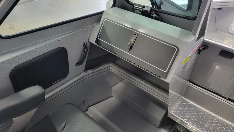 Slide: The Image of 2025 Smoker Craft Phantom 20 X2 interior with storage compartment and seating. - 11