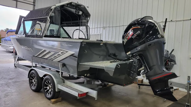Slide: The Image of 2025 Smoker Craft Phantom 20 X2 offshore boat with Yamaha Vmax 250 SHO engine in a garage. - 19