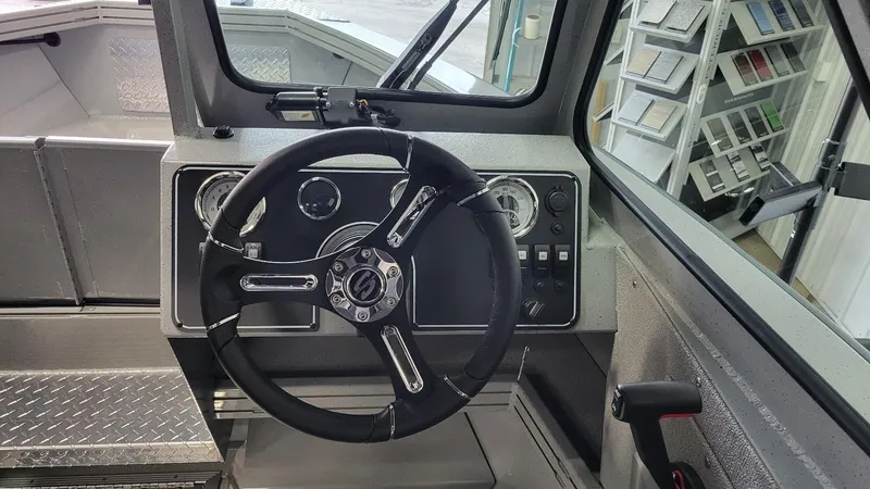 Slide: The Image of 2025 Smoker Craft Phantom 20 X2 offshore boat dashboard with steering wheel and controls. - 8