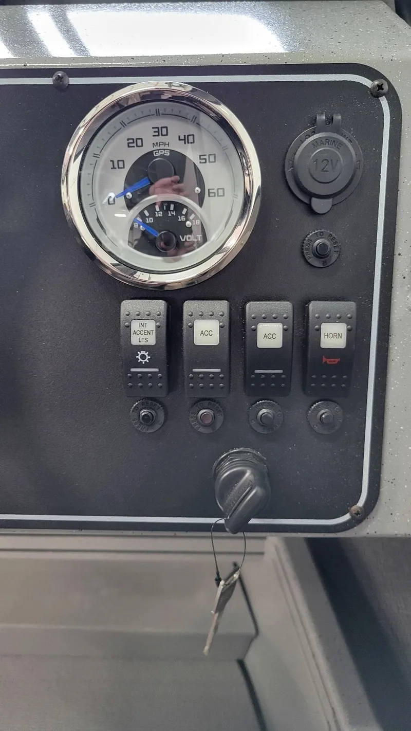 Slide: The Image of Dashboard of 2025 Smoker Craft Phantom 20 X2 with speedometer and control switches. - 9