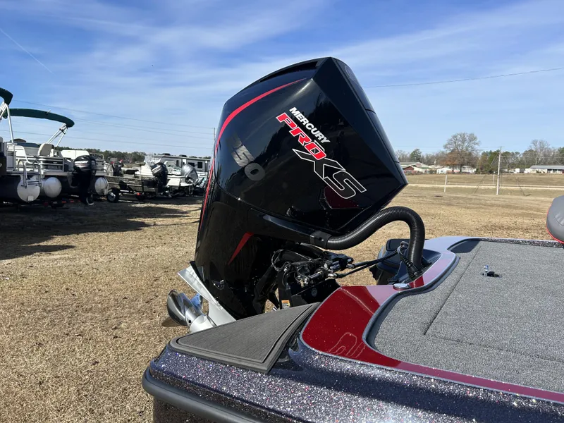 Slide: The Image of 2024 Triton 20XP boat with Mercury Pro XS engine in outdoor setting. - 13