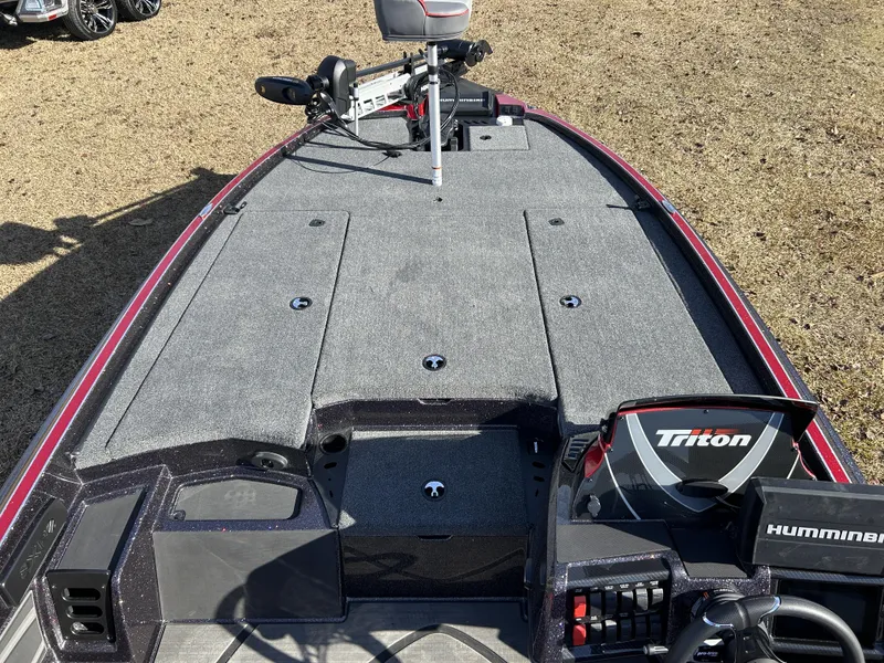 Slide: The Image of 2024 Triton 20XP fishing boat deck with Humminbird electronics and trolling motor. - 16