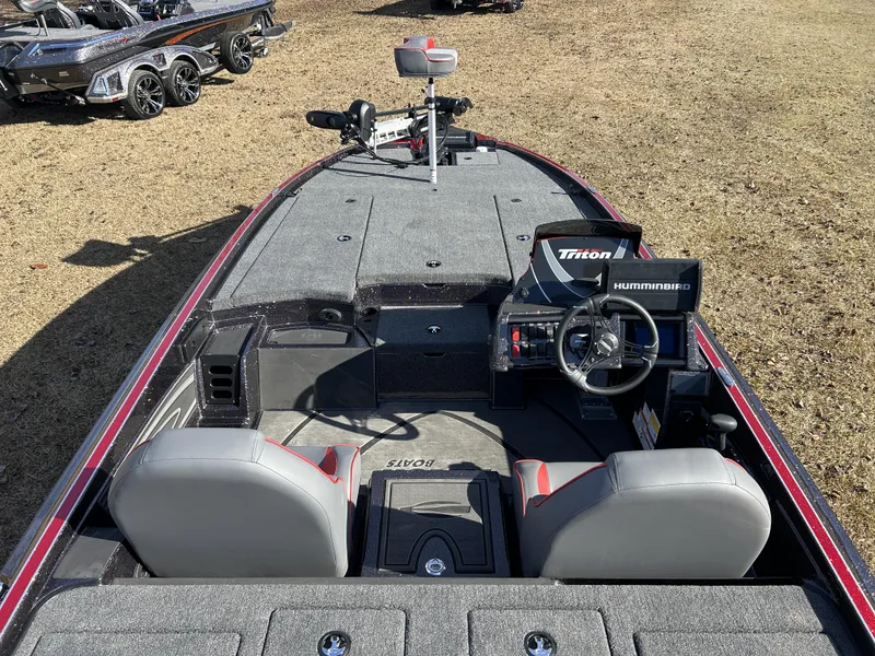 Slide: The Image of 2024 Triton 20XP boat interior with steering wheel and seats on display. - 6