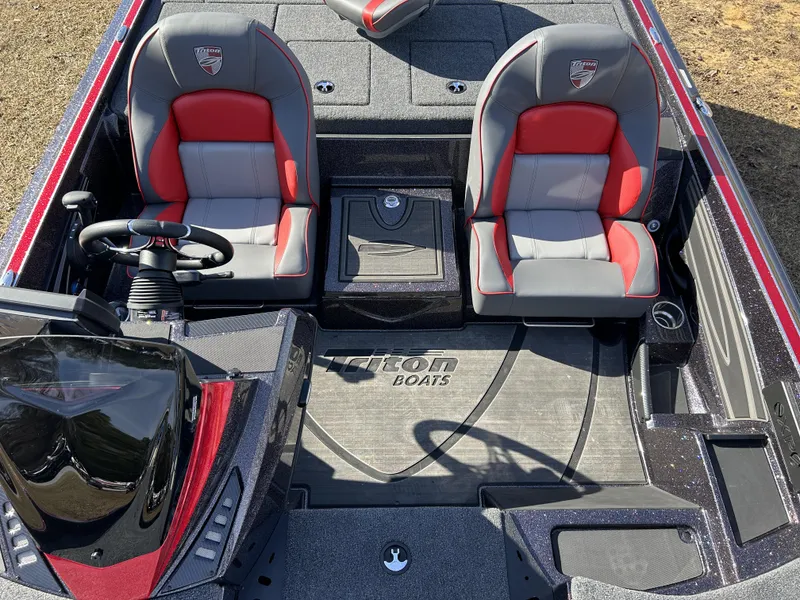 Slide: The Image of 2024 Triton 20XP boat interior with dual seats and steering wheel. - 8