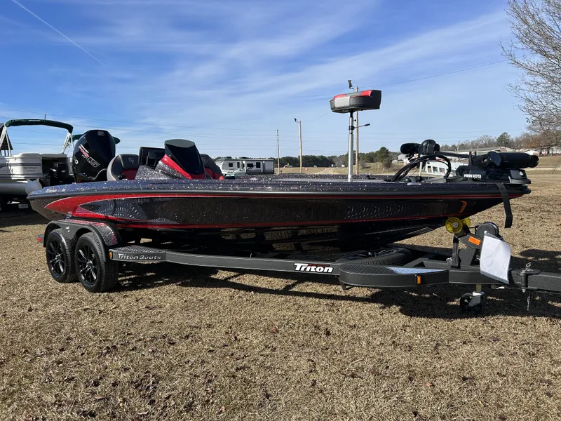 Slide: The Image of 2024 Triton 20XP boat on trailer, parked on grass under clear blue sky. - 9