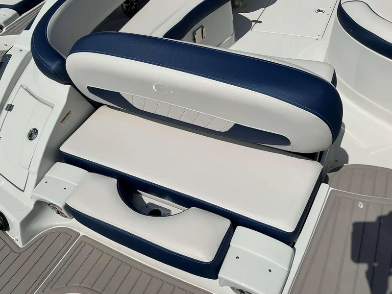 Slide: The Image of 2024 Crownline 270 XSS boat seating with blue and white upholstery. - 13