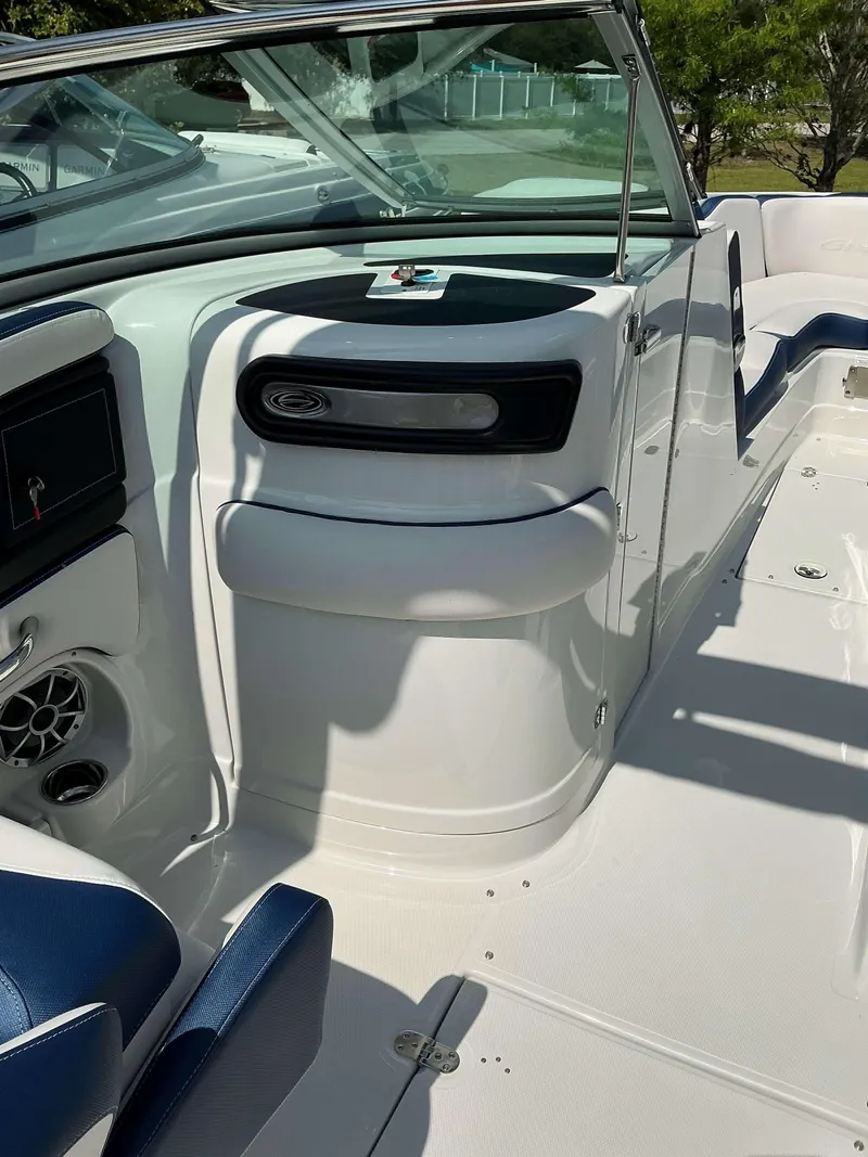 Slide: The Image of 2024 Crownline 270 XSS boat interior with seating and dashboard details. - 8