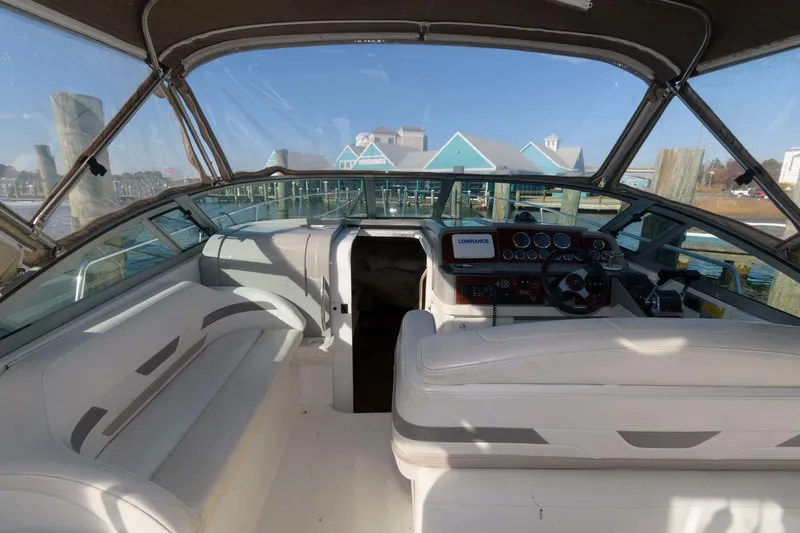 Slide: The Image of 2002 Formula 31 PC boat interior with helm and seating area. - 2