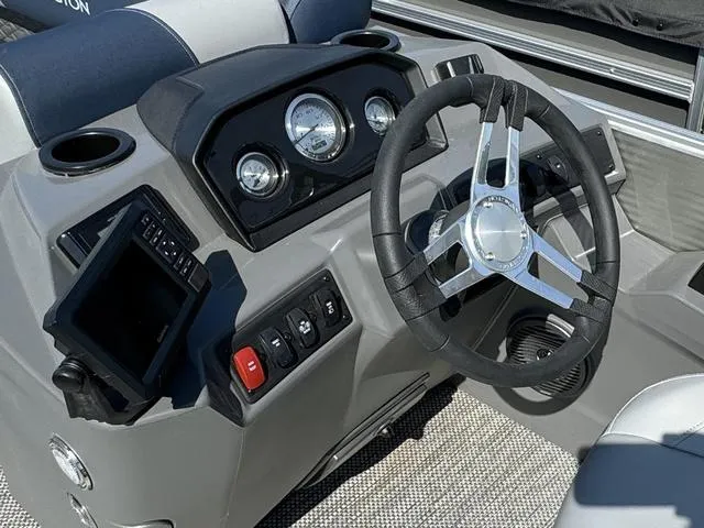 Slide: The Image of 2024 Bennington 22 SSR boat interior seating with cup holders. - 11