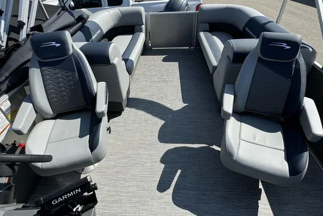 Slide: The Image of 2024 Bennington 22 SSR pontoon boat in a showroom. - 12
