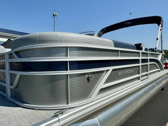 Slide: The Image of 2024 Bennington 22 SSR boat dashboard with steering wheel and control panel. - 4