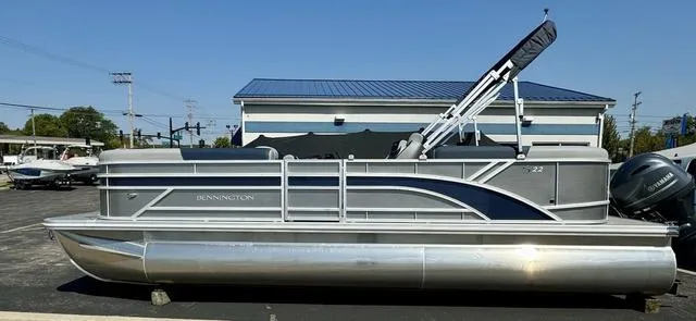 Slide: The Image of 2024 Bennington 22 SSR pontoon boat interior with gray and blue seating. - 5
