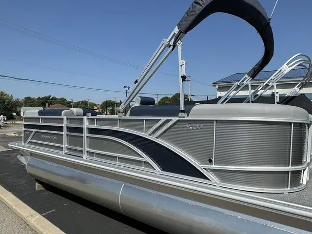 Slide: The Image of 2024 Bennington 22 SSR pontoon boat in a showroom. - 6