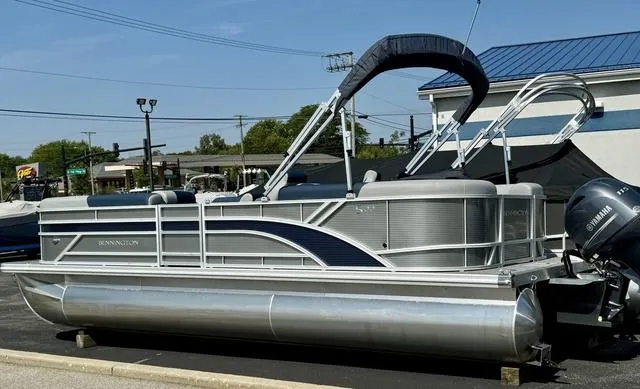 Slide: The Image of 2024 Bennington 22 SSR boat interior seating with gray and blue upholstery. - 7