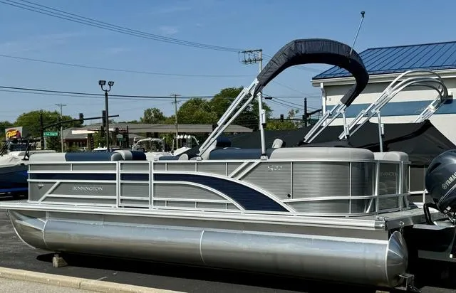 Slide: The Image of 2024 Bennington 22 SSR pontoon boat interior with gray and blue seating. - 8
