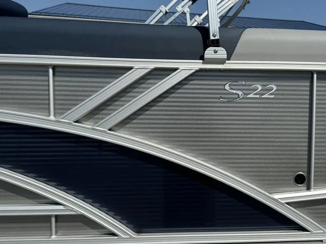 Slide: The Image of 2024 Bennington 22 SSR boat interior seating with gray and blue upholstery. - 9