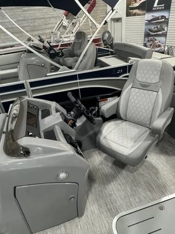 Slide: The Image of Storage compartment of 2024 Bennington 25 LTFB boat with wrapped items. - 13