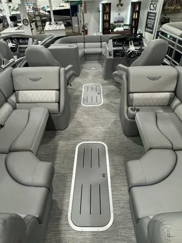 Slide: The Image of 2024 Bennington 25 LTFB pontoon boat undercarriage on wheeled supports. - 15