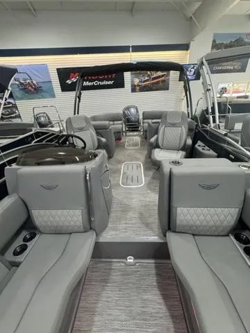 Slide: The Image of 2024 Bennington 25 LTFB pontoon boat interior with luxurious gray seating. - 17