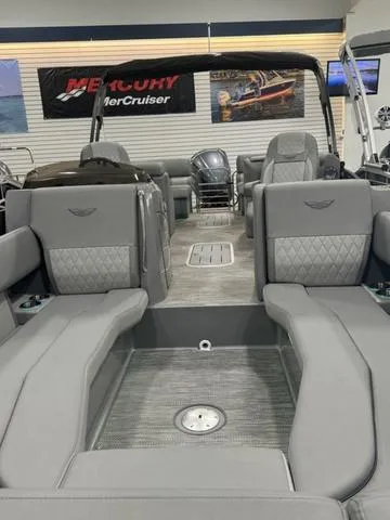 Slide: The Image of 2024 Bennington 25 LTFB pontoon boat with luxurious gray seating and spacious interior. - 18