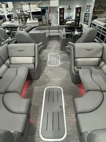 Slide: The Image of 2024 Bennington 25 LTFB pontoon boat interior with luxurious gray seating and modern design. - 19