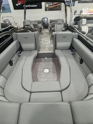Slide: The Image of 2024 Bennington 25 LTFB pontoon boat interior with luxurious seating and modern design. - 20