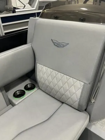Slide: The Image of 2024 Bennington 25 LTFB boat seat with quilted design and cup holders. - 21