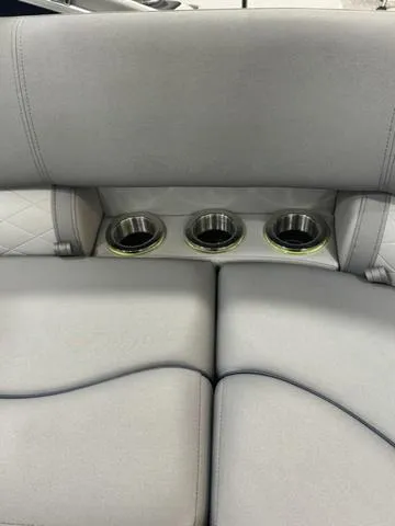 Slide: The Image of 2024 Bennington 25 LTFB boat seating with built-in cup holders. - 22