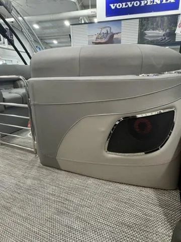 Slide: The Image of 2024 Bennington 25 LTFB boat interior with modern seating and speaker detail. - 23