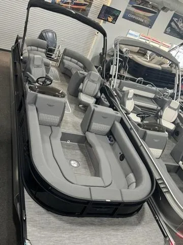 Slide: The Image of 2024 Bennington 25 LTFB boat interior with luxurious gray quilted seating. - 8
