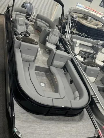Slide: The Image of 2024 Bennington 25 LTFB pontoon boat with black railings and aluminum pontoons. - 9