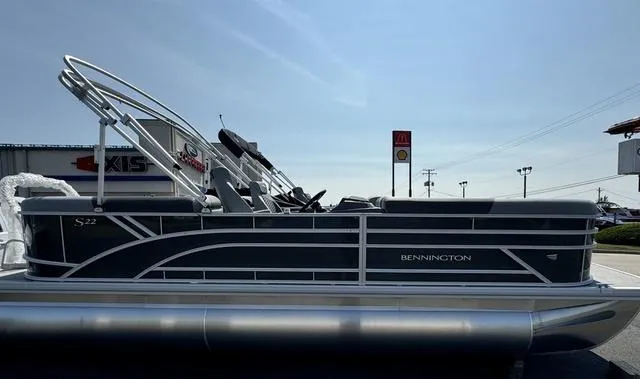Slide: The Image of 2024 Bennington 22 SSR pontoon boat, sleek gray exterior with modern railing design. - 1