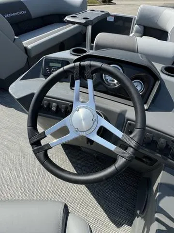 Slide: The Image of 2024 Bennington 22 SSR pontoon boat interior with gray and white seating. - 10