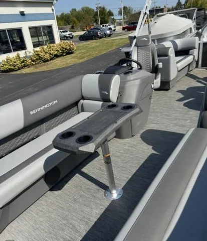 Slide: The Image of 2024 Bennington 22 SSR pontoon boat in a warehouse. - 12