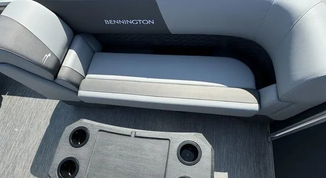 Slide: The Image of 2024 Bennington 22 SSR pontoon boat in a warehouse. - 14